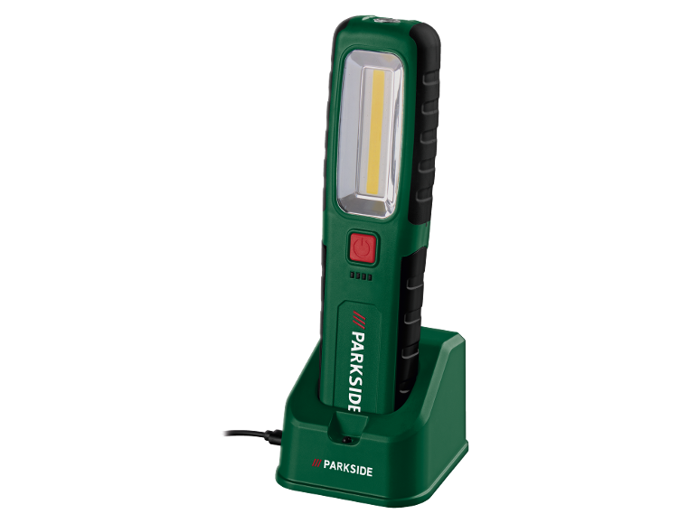 Lampe de travail LED rechargeable dans une station de charge, verte et noire.