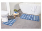 Deux tapis de bain à carreaux.