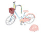 Un vélo rose pour enfant avec un panier et un casque.