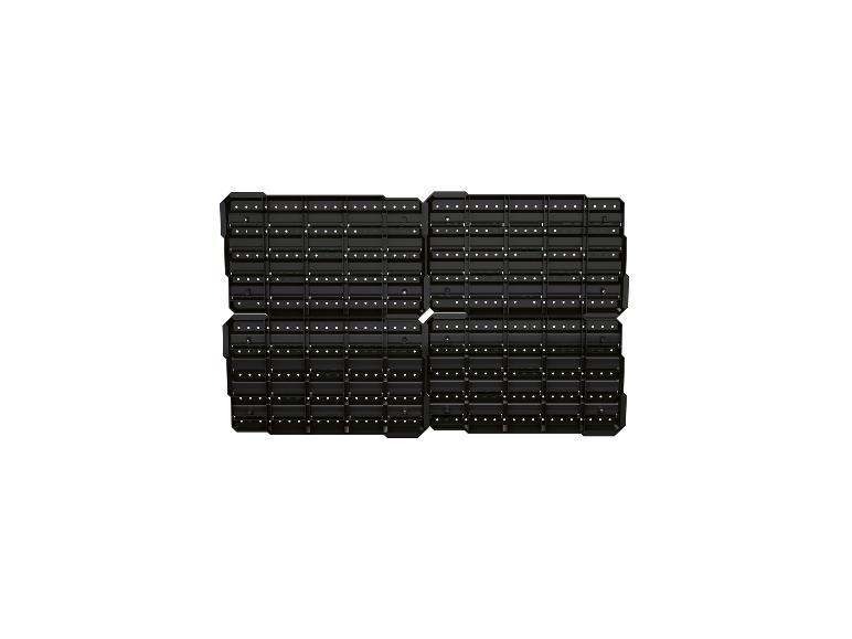 Quatre panneaux de rangement modulaires noirs avec des surfaces perforées, disposés en grille 2x2.