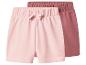 Deux shorts bébé roses et rose foncé avec taille élastique et un nœud.