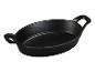 Poêle ovale en fonte noire avec deux poignées.
