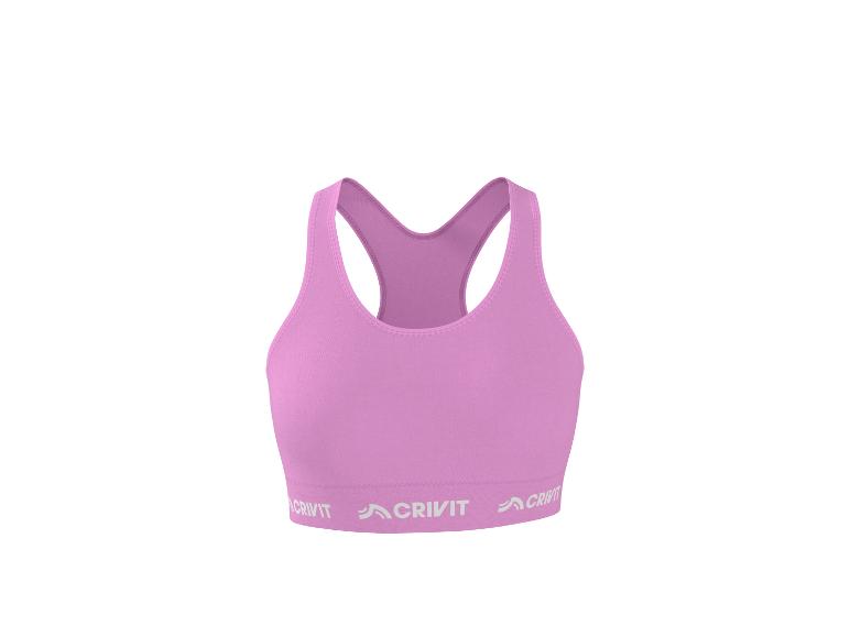 Soutien-gorge de sport rose avec dos nageur et logo de la marque sur la bande inférieure.