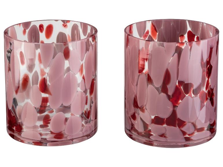 Deux vases cylindriques en verre avec des taches roses et rouges.