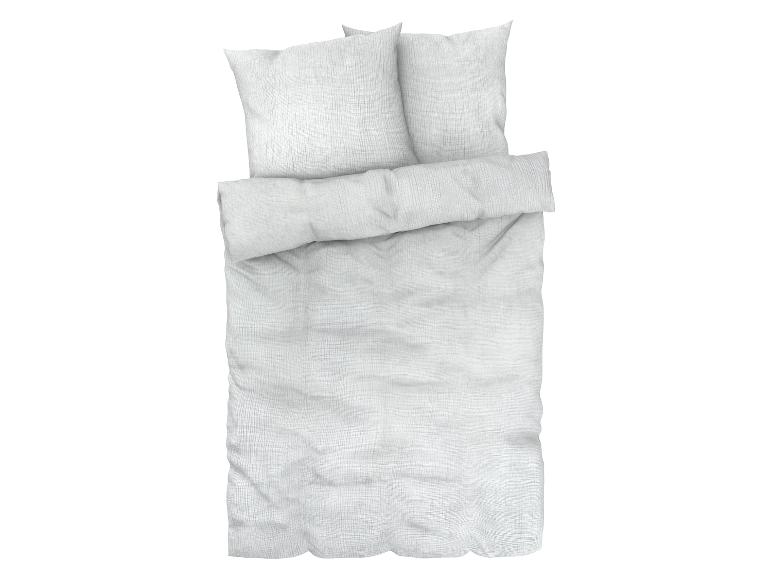 Draps blancs avec deux oreillers