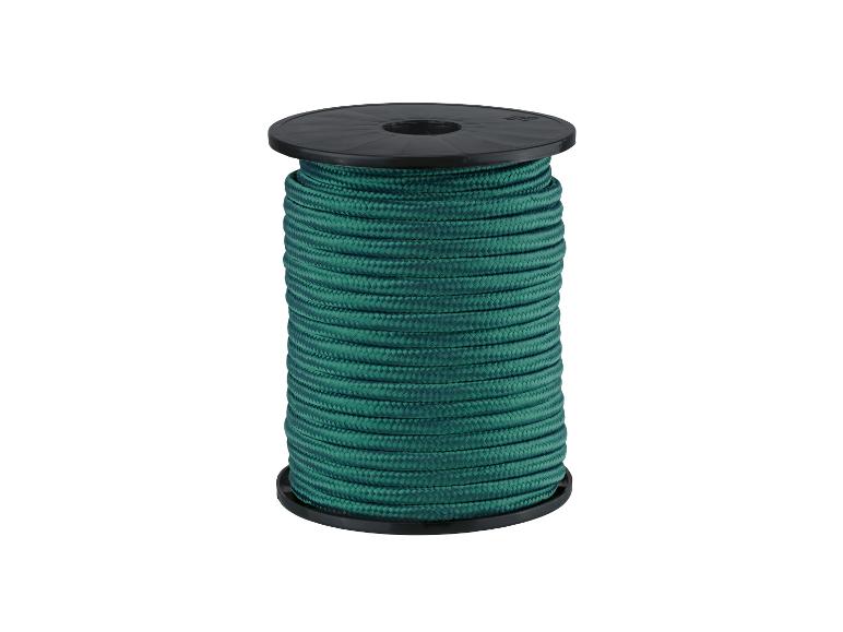 Bobine de corde verte sur fond blanc