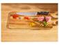 Préparation culinaire : couteau SilverCrest, viande, épices et légumes sur planche à découper.