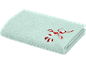 Serviette de toilette bleu clair avec une broderie de canne à sucre rouge et blanche