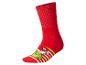 Chaussettes rouges avec un personnage de dessin animé vert et des rayures jaunes et blanches.
