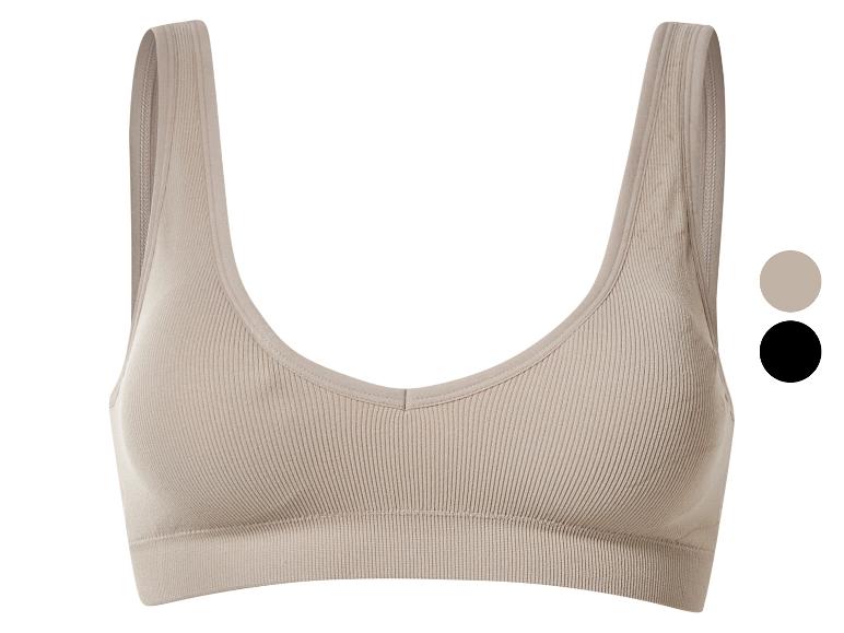 Soutien-gorge de sport côtelé beige à larges bretelles.