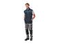 Homme en gilet et pantalon de travail PARKISDE, souriant