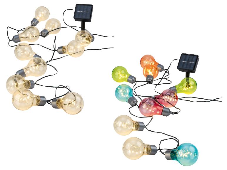 Guirlandes solaires avec ampoules claires et colorées.
