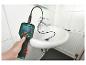 Caméra d'inspection avec écran, utilisée pour inspecter un drain de lavabo.