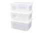 Trois boîtes de rangement transparentes empilables.