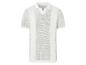 Polo blanc en maille ajourée : vêtement d'été élégant.