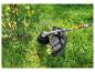 Coupe-herbe Parkside en action, taillant l'herbe et les mauvaises herbes.