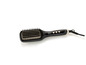 Une brosse à cheveux noire SilverCrest avec réglage de température numérique.
