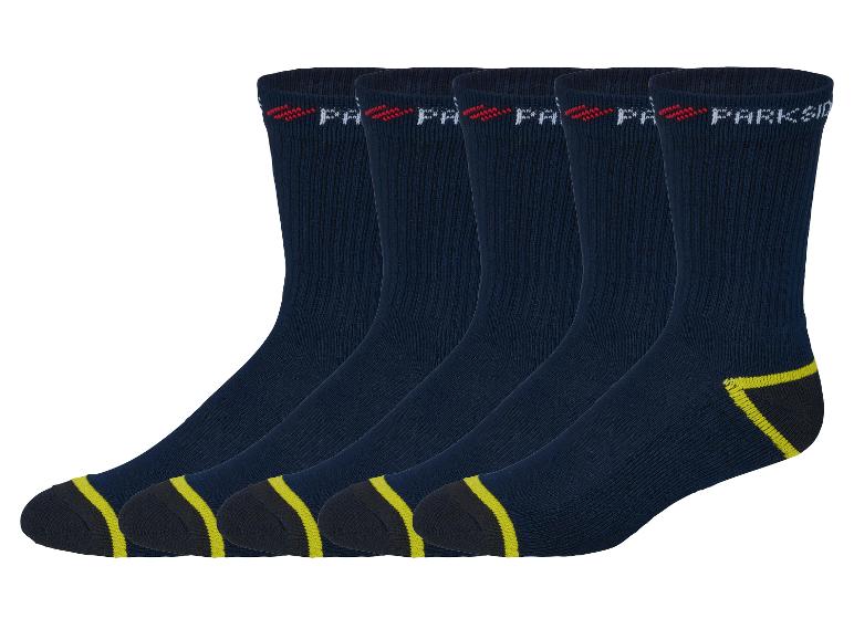 Quatre paires de chaussettes Parkside bleu marine avec des détails jaunes.