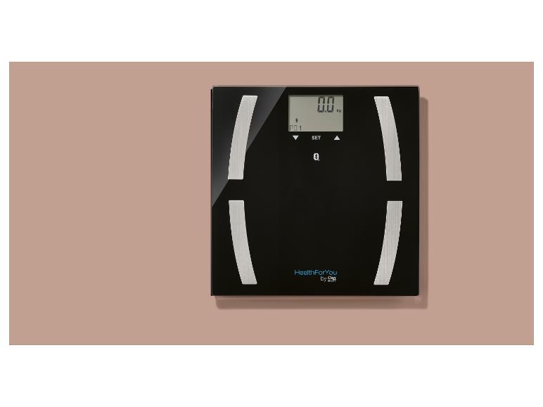 Pèse-personne numérique noir avec affichage '0.0 kg' et logo 'HealthForYou by Cien'.