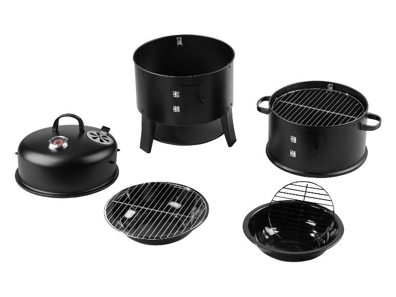 Ensemble barbecue et fumoir noir, démonté en pièces.