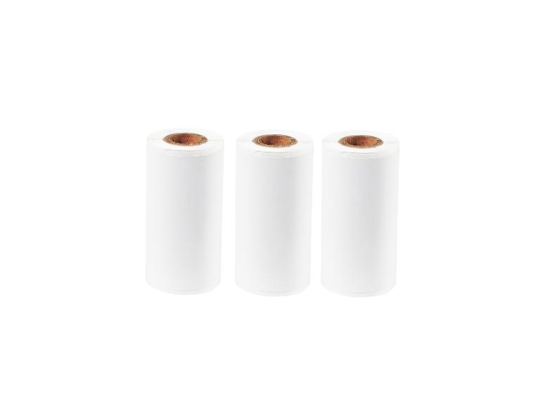 Trois rouleaux de papier thermique blanc avec des noyaux bruns.