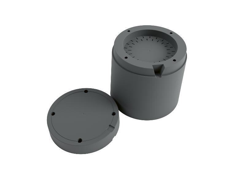 Boîtier cylindrique gris avec couvercle séparé.