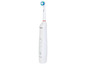Une brosse à dents électrique blanche Nevodent.