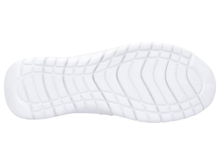 Semelle de chaussure blanche avec motif texturé pour l'adhérence.
