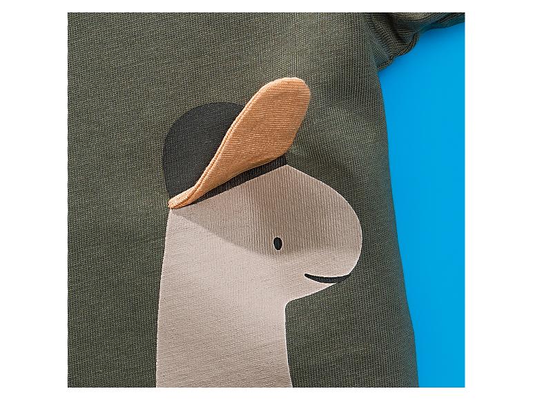 T-shirt enfant avec application dinosaure portant une casquette