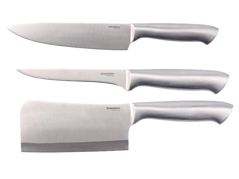 Ensemble de trois couteaux de cuisine en acier inoxydable, dont un couteau de chef, un couteau utilitaire et un couperet.