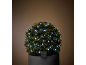 Topiaire solaire avec guirlande lumineuse LED blanche dans un pot gris foncé.