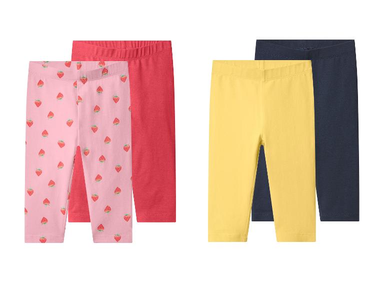 Lot de deux leggings pour filles : rose à fraises et rouge, plus jaune et bleu foncé.