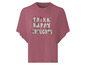 Un t-shirt rose avec l'inscription 'Think Happy Thoughts' dans un style vintage.