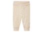 Leggings bébé en tricot beige.