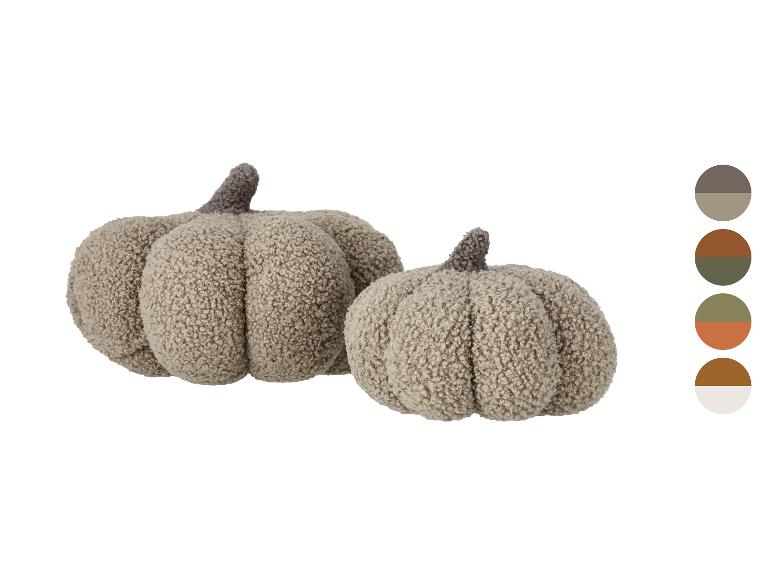 Deux citrouilles décoratives douces et beiges avec des tiges marron et une palette de couleurs.