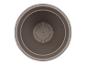 Un pot rond de couleur marron avec un trou de drainage.