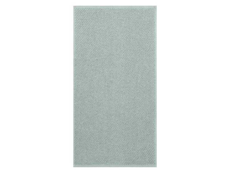 Serviette de toilette en coton vert clair avec un motif à rayures diagonales