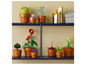 LEGO fleurs et cactus en pots sur une étagère.
