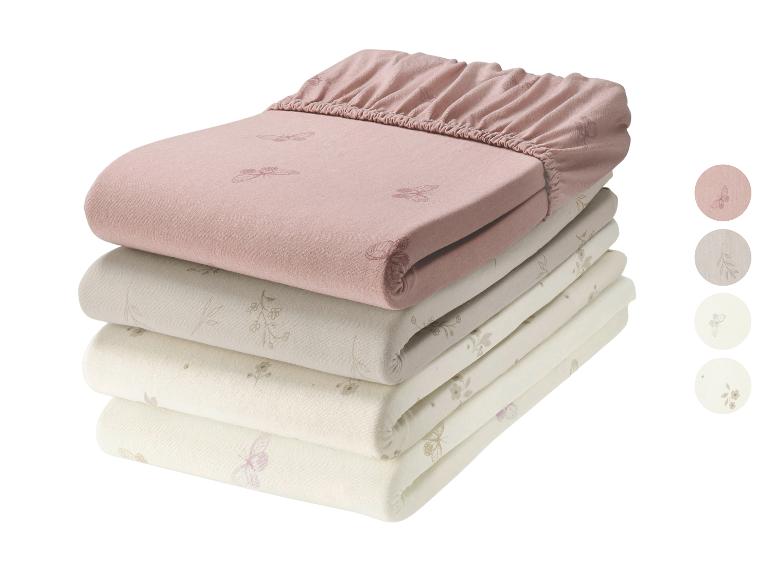 Pile de draps-housses pour bébé avec motifs papillons et floraux