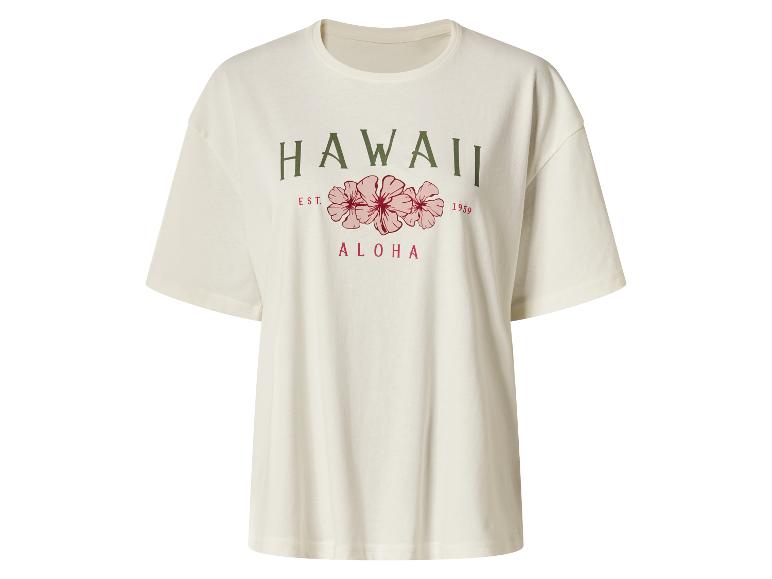 T-shirt crème avec texte 'HAWAII EST. 1959 ALOHA' et fleurs d'hibiscus roses