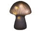 Lampe de table décorative en forme de champignon en verre strié avec lumière chaude.
