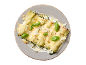 Cannellonis au four aux épinards et ricotta, garnis de basilic et de copeaux de fromage.