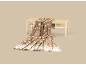 Plaid marron avec motifs de flocons de neige blancs, posé sur un banc en bois.