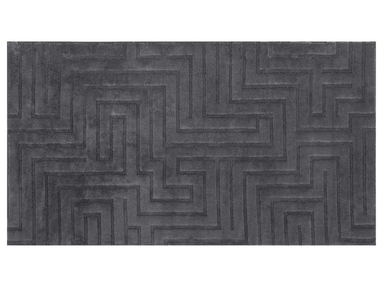 Tapis gris avec un motif géométrique de labyrinthe