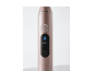 Brosse à dents électrique rose avec bouton marche/arrêt et écran affichant le mode « Brighten ».