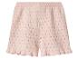 Short en maille rose clair avec motif ajouré et ourlet volanté.
