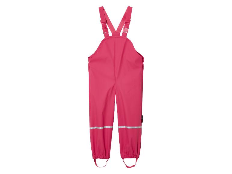 Pantalon de pluie rose à bretelles.