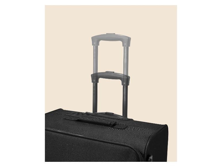 Valise de voyage noire avec poignée télescopique étendue sur fond beige.
