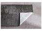 Tapis shaggy gris foncé avec envers antidérapant.