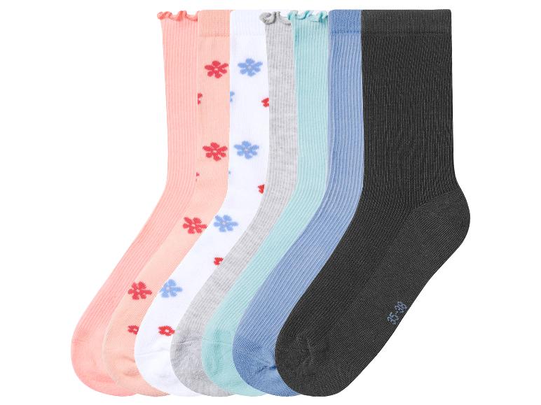 Lot de 7 paires de chaussettes côtelées de couleurs assorties, certaines à fleurs, et une noire.